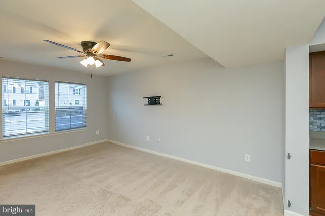 a view of empty room with windows