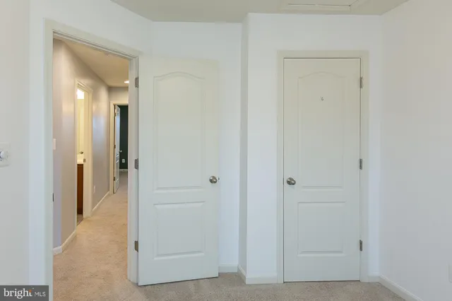 a front view of a house with a yard and parking space