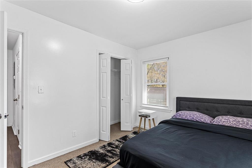 1111 Valley View Road Southeast Atlanta, GA 30315 - Photo 15 of 31 a bedroom with a bed and a window