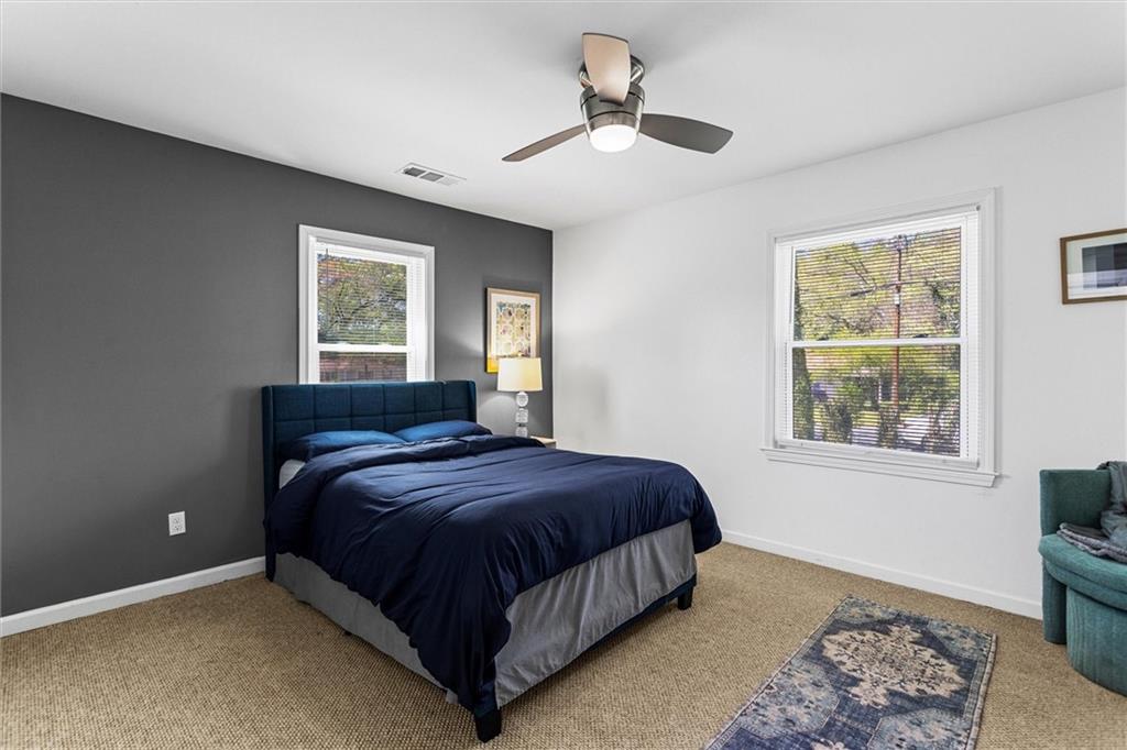 1111 Valley View Road Southeast Atlanta, GA 30315 - Photo 16 of 31 a bedroom with a bed lamp and a window