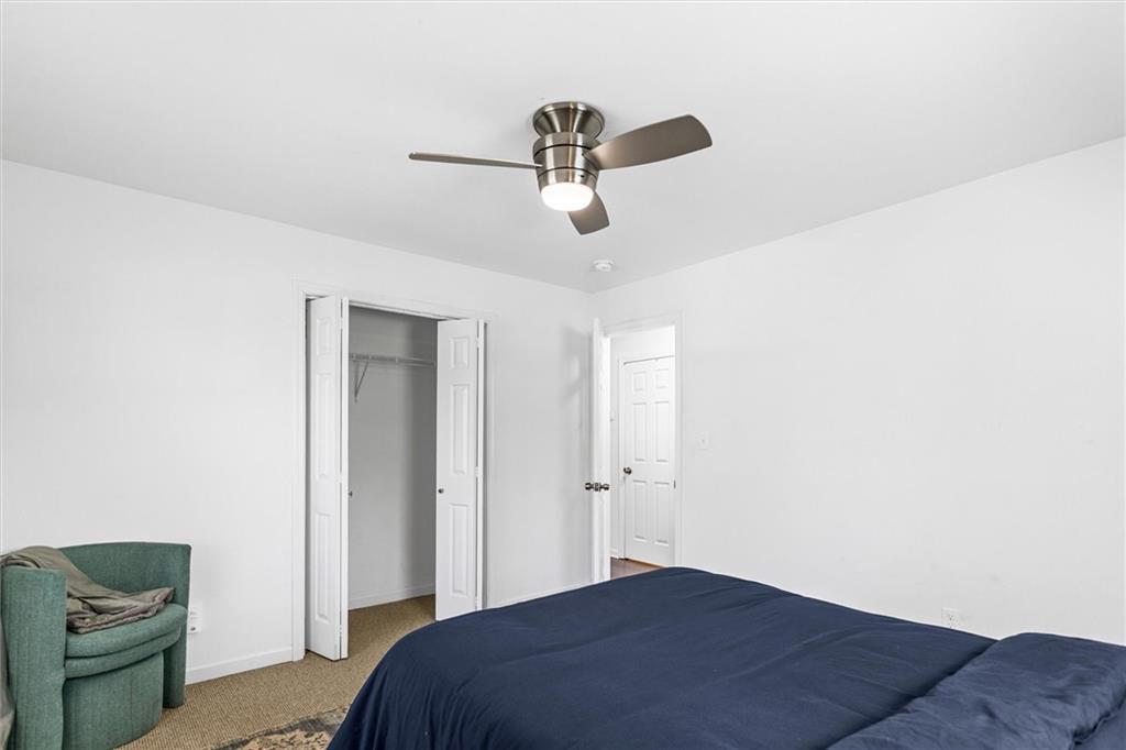 1111 Valley View Road Southeast Atlanta, GA 30315 - Photo 17 of 31 a bedroom with a bed and a painting on the wall