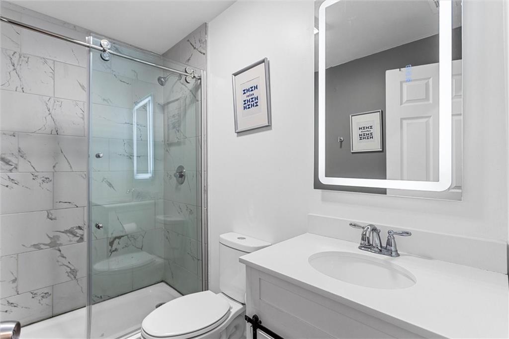 1111 Valley View Road Southeast Atlanta, GA 30315 - Photo 25 of 31 a bathroom with a sink toilet and shower