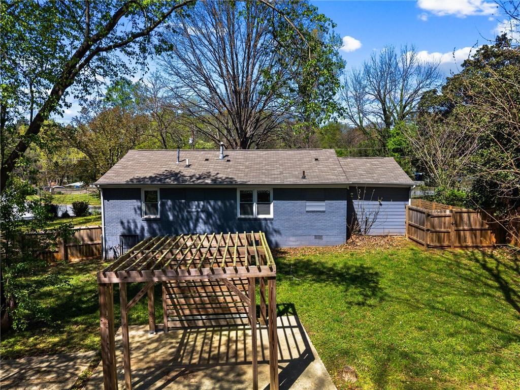 1111 Valley View Road Southeast Atlanta, GA 30315 - Photo 26 of 31 a backyard of a house with table and chairs