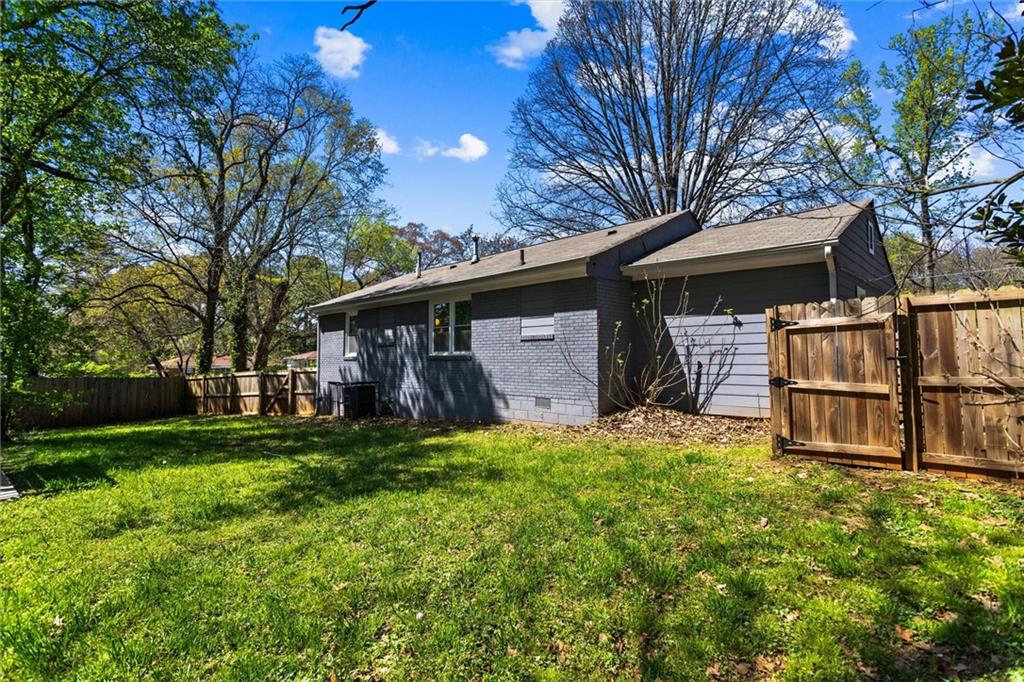 1111 Valley View Road Southeast Atlanta, GA 30315 - Photo 27 of 31 a front view of house with yard and trees