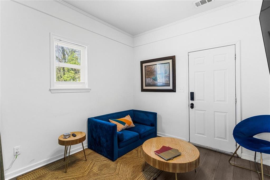 1111 Valley View Road Southeast Atlanta, GA 30315 - Photo 5 of 31 a living room with furniture and a chair