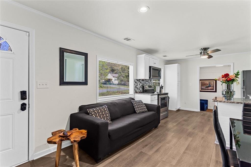 1111 Valley View Road Southeast Atlanta, GA 30315 - Photo 6 of 31 a living room with furniture and wooden floor
