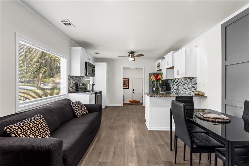 1111 Valley View Road Southeast Atlanta, GA 30315 - Photo 7 of 31 a living room with furniture and a window