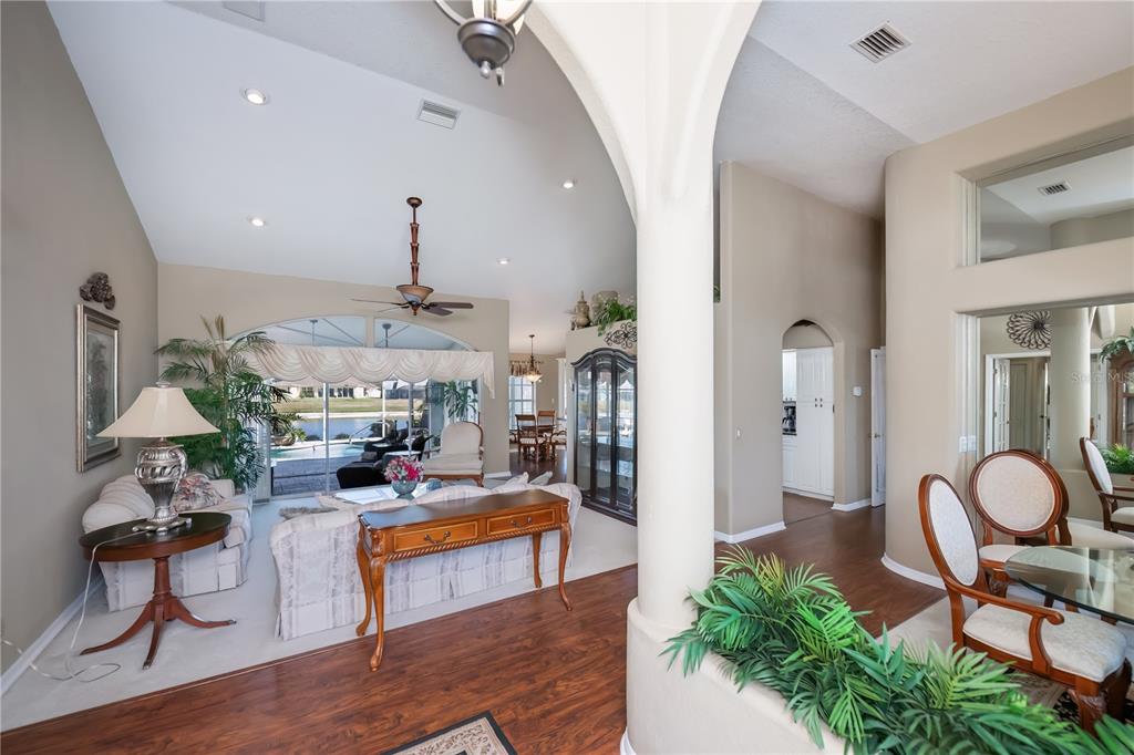 26373 Madagascar Road Punta Gorda, FL 33983 - Photo 16 of 90 a living room with furniture and a chandelier