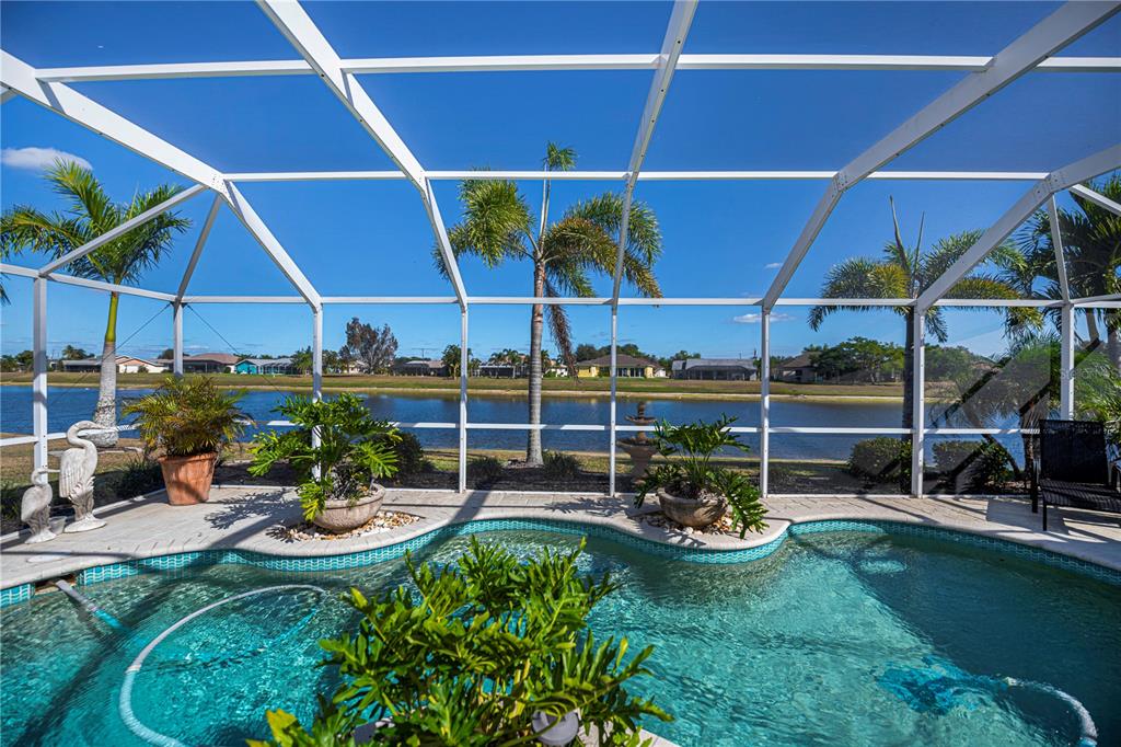 26373 Madagascar Road Punta Gorda, FL 33983 - Photo 2 of 90 a view of a backyard with sitting area and furniture