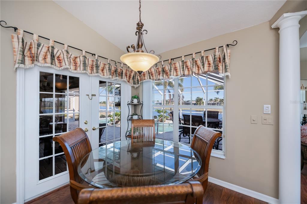 26373 Madagascar Road Punta Gorda, FL 33983 - Photo 27 of 90 a view of a dining room with furniture window and wooden floor