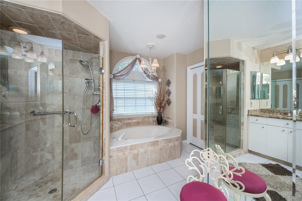 26373 Madagascar Road Punta Gorda, FL 33983 - Photo 38 of 90 a bathroom with a tub shower vanity and a sink