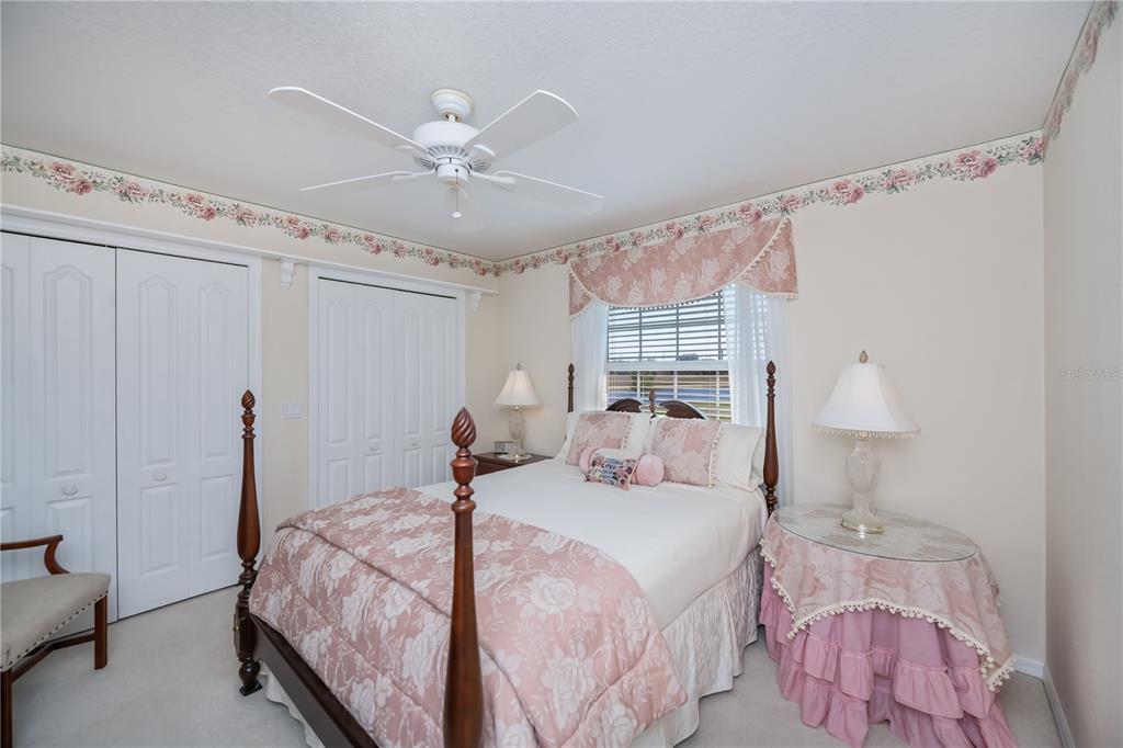 26373 Madagascar Road Punta Gorda, FL 33983 - Photo 43 of 90 a bedroom with a bed and a chandelier