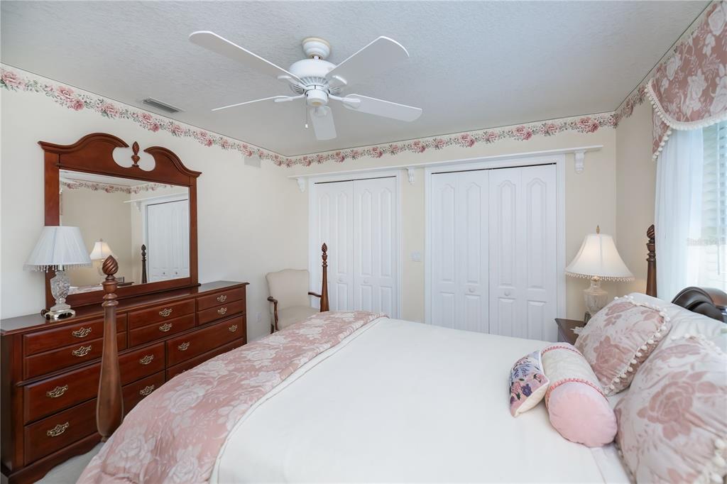 26373 Madagascar Road Punta Gorda, FL 33983 - Photo 44 of 90 a bedroom with a bed and a dresser