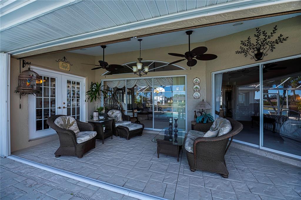 26373 Madagascar Road Punta Gorda, FL 33983 - Photo 54 of 90 a living room with furniture and a ceiling fan