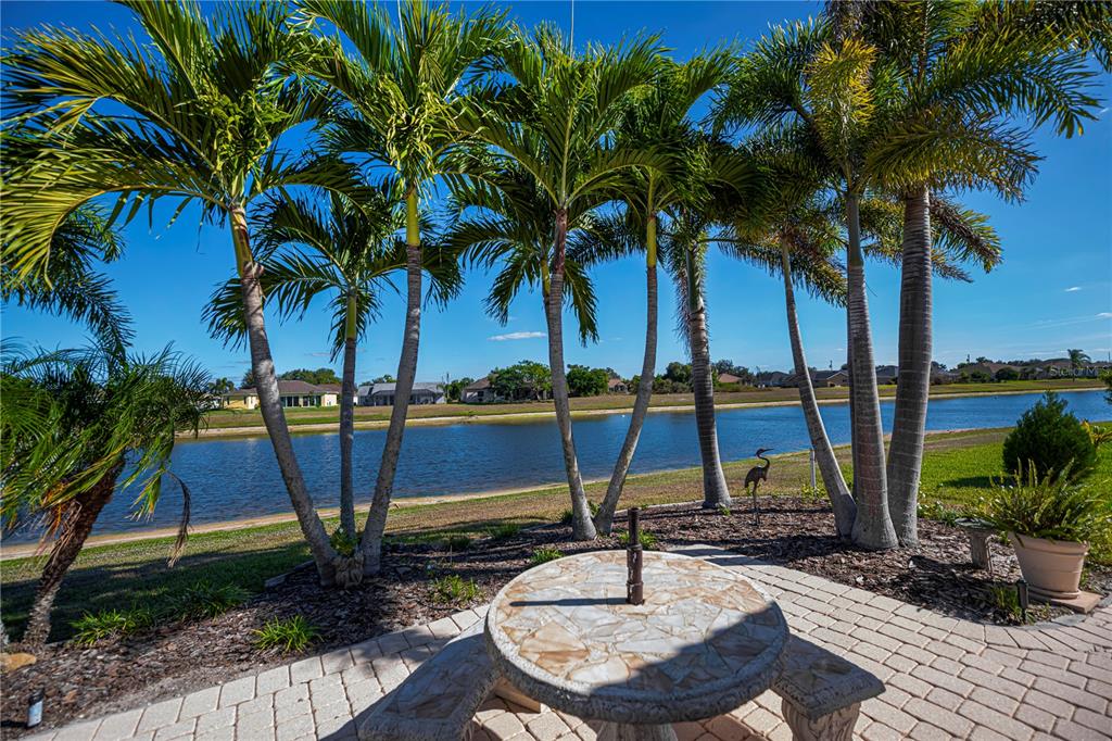 26373 Madagascar Road Punta Gorda, FL 33983 - Photo 66 of 90 a view of swimming pool with a table and chairs