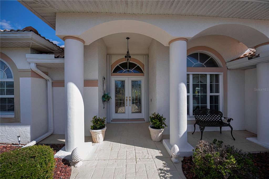 26373 Madagascar Road Punta Gorda, FL 33983 - Photo 7 of 90 a front view of a house with garden