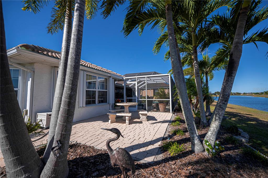 26373 Madagascar Road Punta Gorda, FL 33983 - Photo 74 of 90 a view of a patio with couches table and chairs and potted plants
