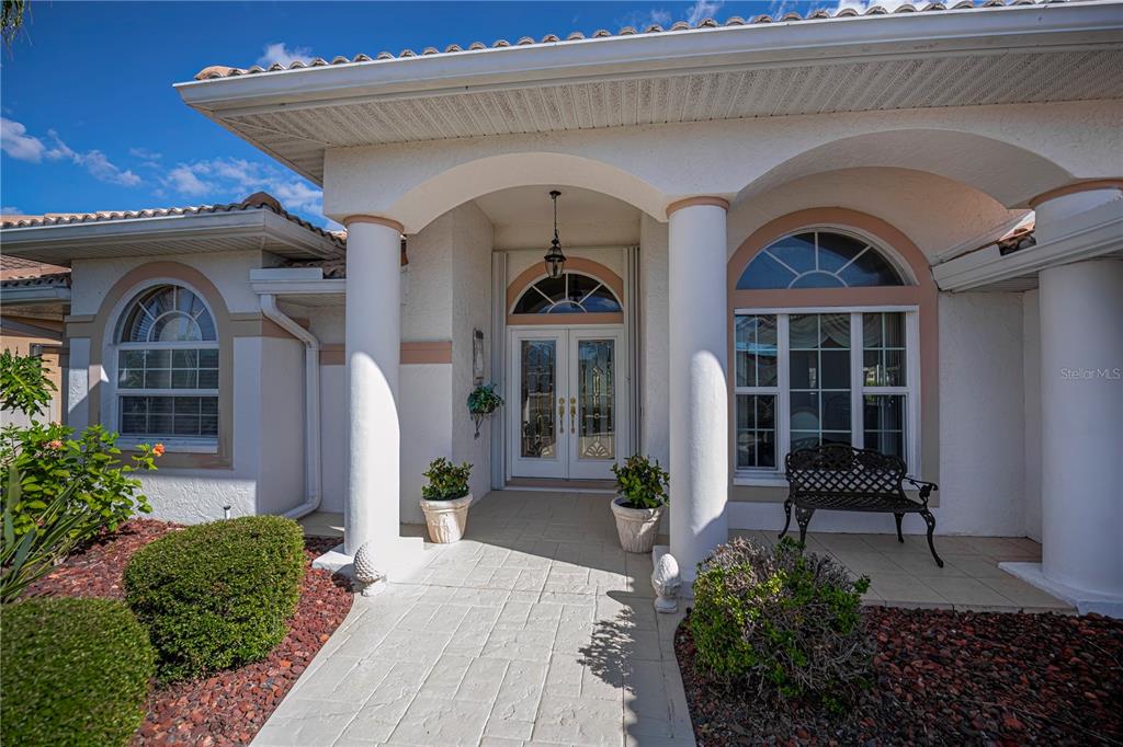26373 Madagascar Road Punta Gorda, FL 33983 - Photo 9 of 90 a front view of a house with garden