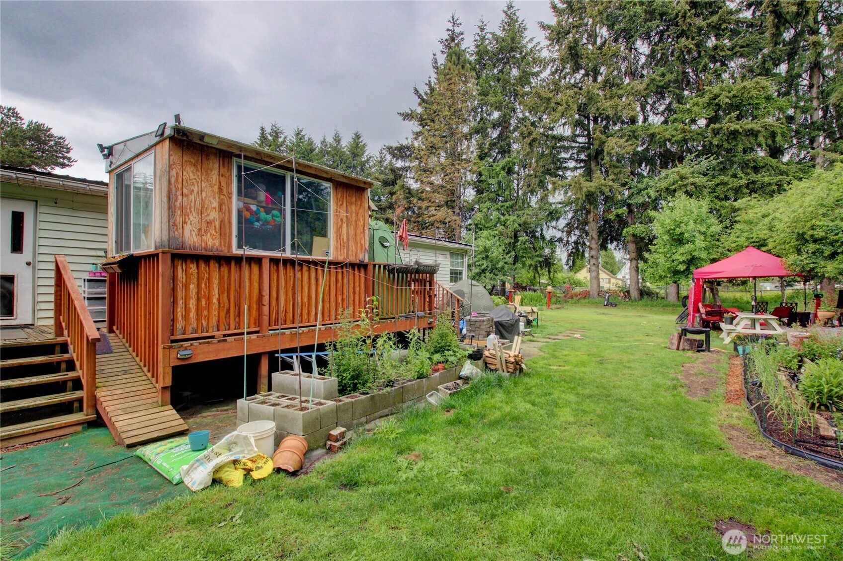 7185 Old Highway 99 North Road Burlington, WA 98233 - Photo 11 of 26 a view of backyard with sitting area and tub