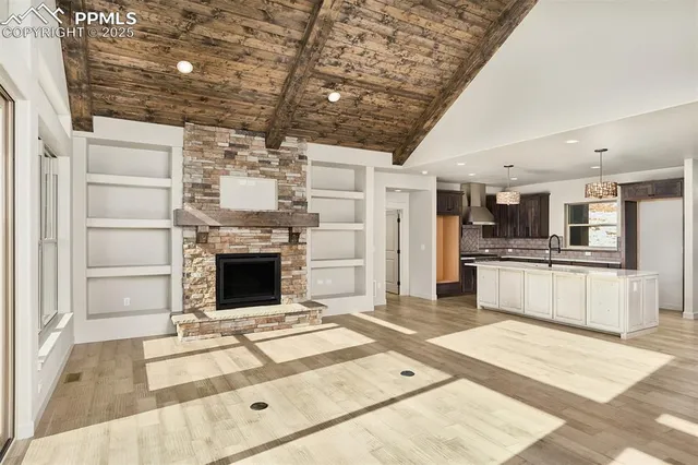 a open kitchen with granite countertop a stove and refrigerator