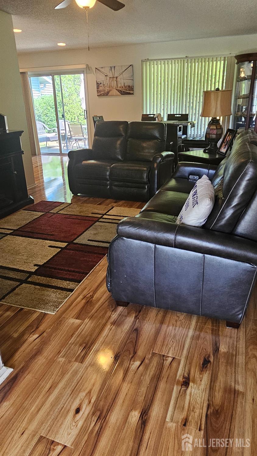 449 B Closter Road, Unit B Monroe Township, NJ 08831 - Photo 2 of 14 a living room with a couch and a floor to ceiling window