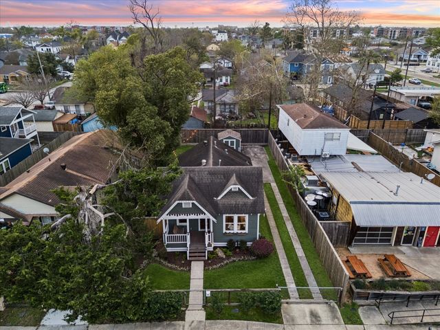 a aerial view of a house with a big yard
