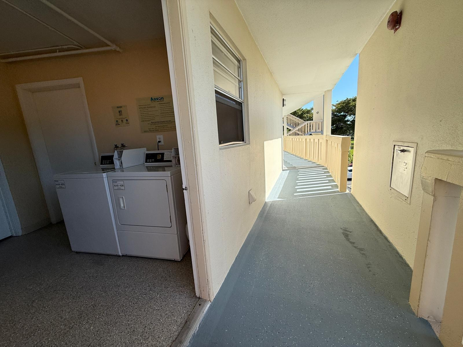 3022 Ainslie Drive, Unit 3022 Boca Raton, FL 33434 - Photo 24 of 29 washer/dryer room and trash shoot