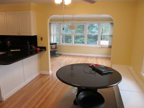 2 Wilfred Terrace Salem, MA 01970 - Photo 12 of 30 a view of a kitchen with a sink and dishwasher with wooden floor