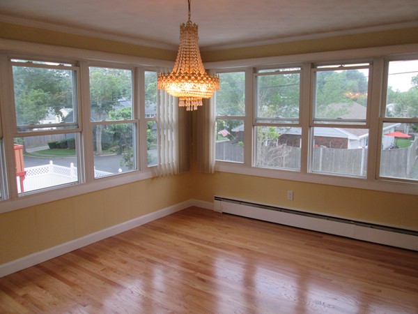 2 Wilfred Terrace Salem, MA 01970 - Photo 14 of 30 a view of an empty room with wooden floor and a window