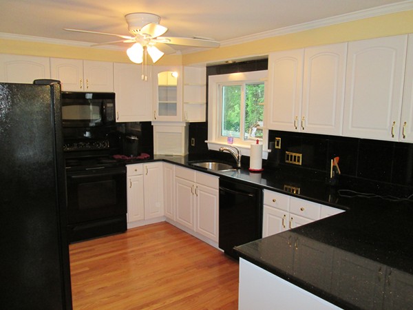 2 Wilfred Terrace Salem, MA 01970 - Photo 15 of 30 a kitchen with stainless steel appliances a refrigerator sink and cabinets