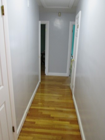 2 Wilfred Terrace Salem, MA 01970 - Photo 17 of 30 a view of a hallway with wooden floor and entryway