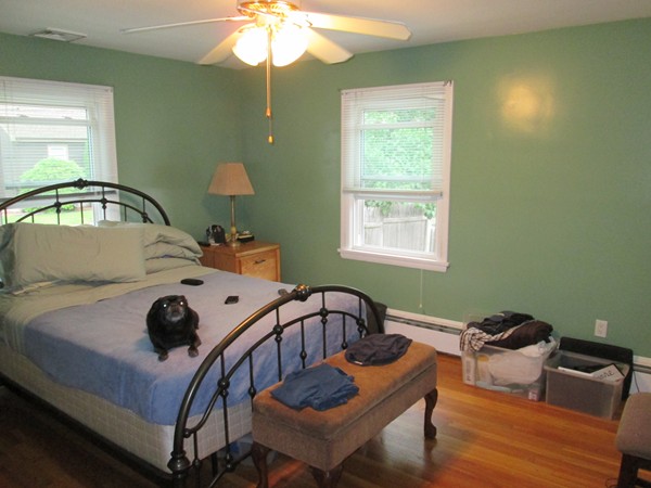 2 Wilfred Terrace Salem, MA 01970 - Photo 22 of 30 a bedroom with a bed and a chandelier