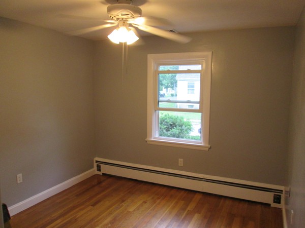 2 Wilfred Terrace Salem, MA 01970 - Photo 24 of 30 an empty room with wooden floor fan and window
