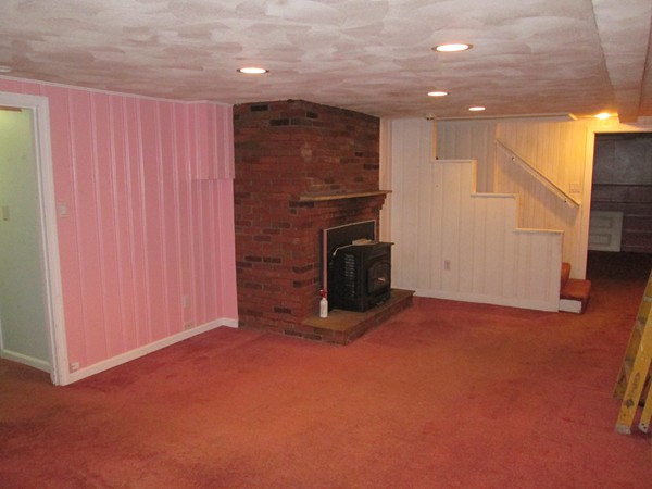 2 Wilfred Terrace Salem, MA 01970 - Photo 26 of 30 a view of an empty room with a fireplace