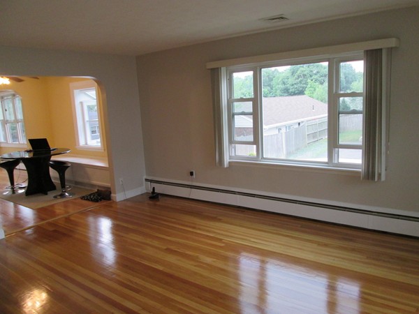 2 Wilfred Terrace Salem, MA 01970 - Photo 10 of 30 a view of an empty room with wooden floor and a window