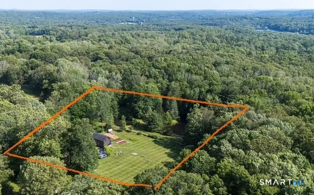 a view of a forest from a balcony