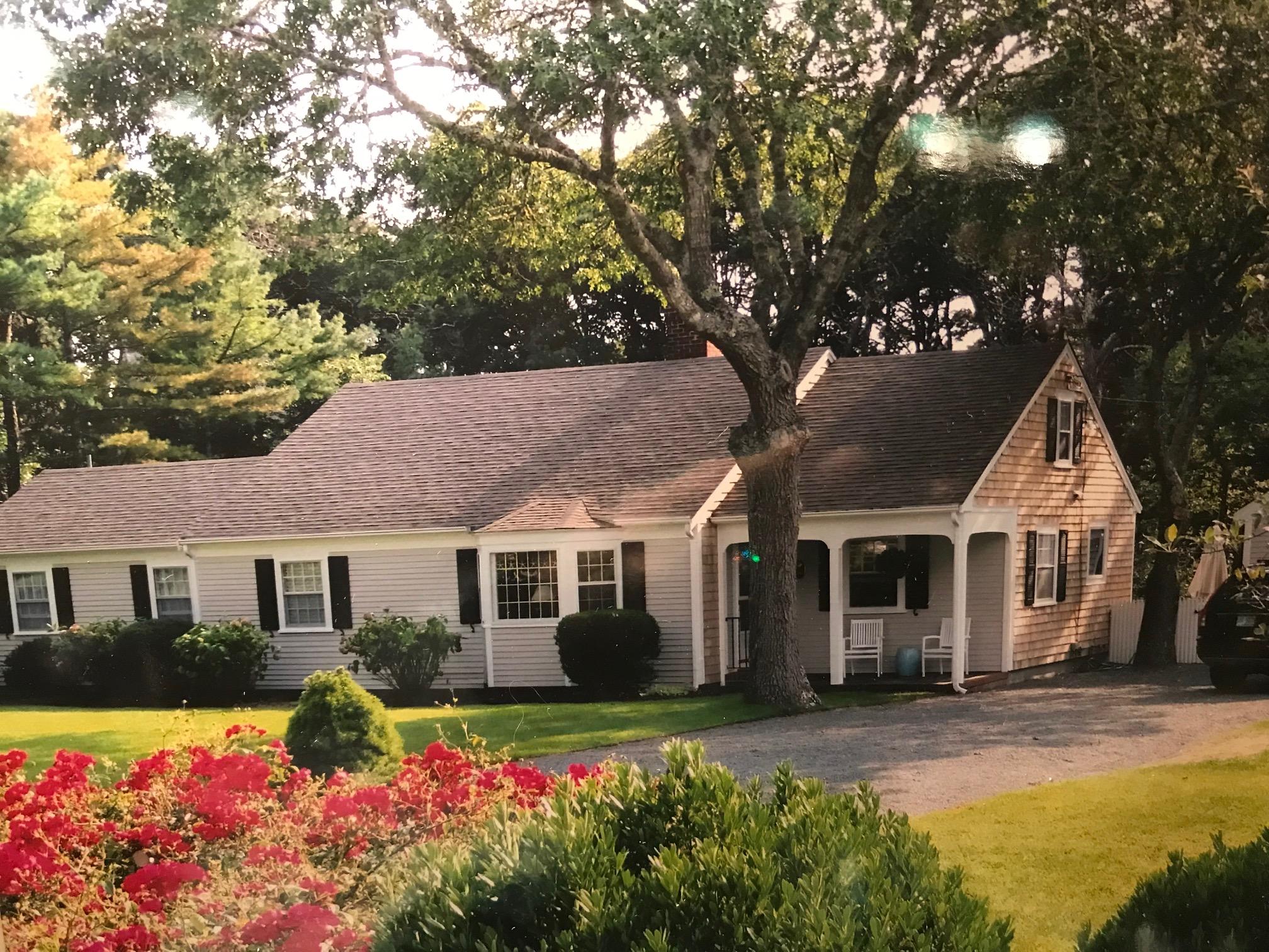 36 Deep Hole Road Harwich Port, MA 02646 - Photo 1 of 34 a front view of a house with a yard and garage