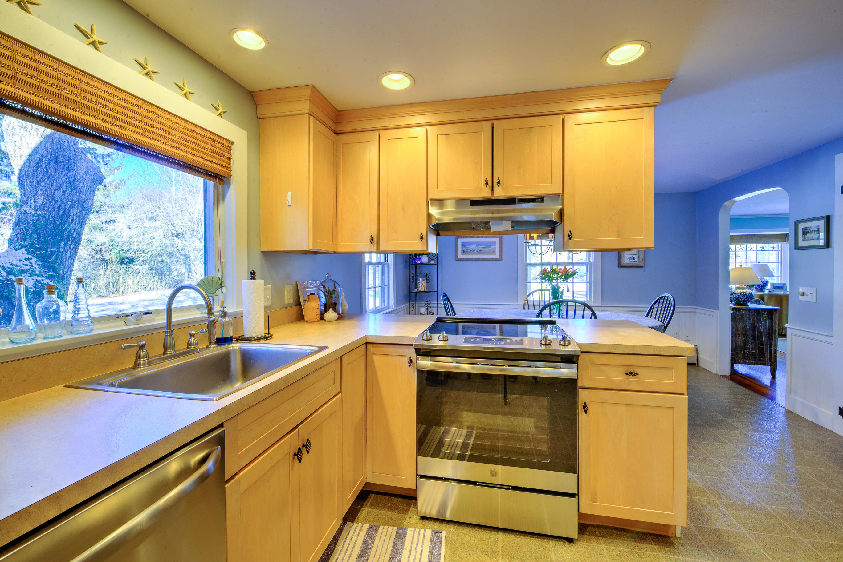 36 Deep Hole Road Harwich Port, MA 02646 - Photo 22 of 34 a kitchen with a stove sink and cabinets