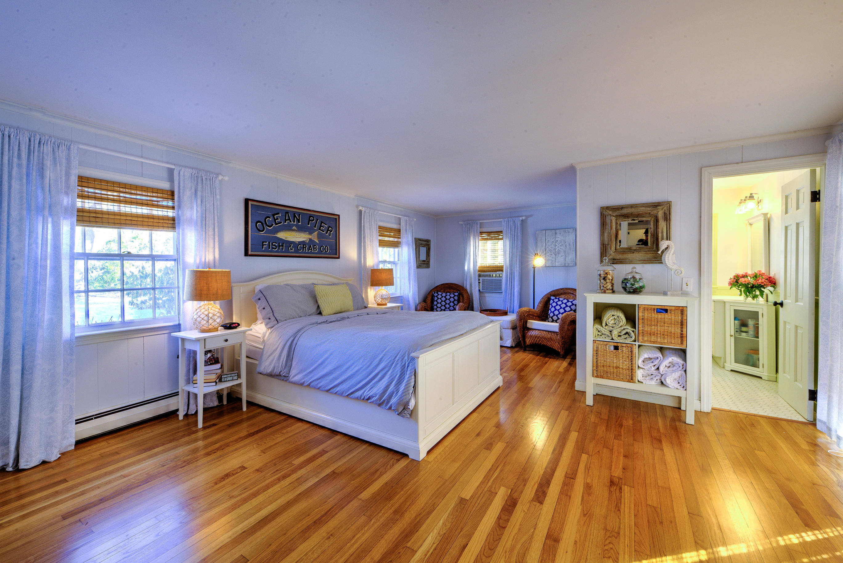 36 Deep Hole Road Harwich Port, MA 02646 - Photo 24 of 34 a spacious bedroom with a bed and wooden floor