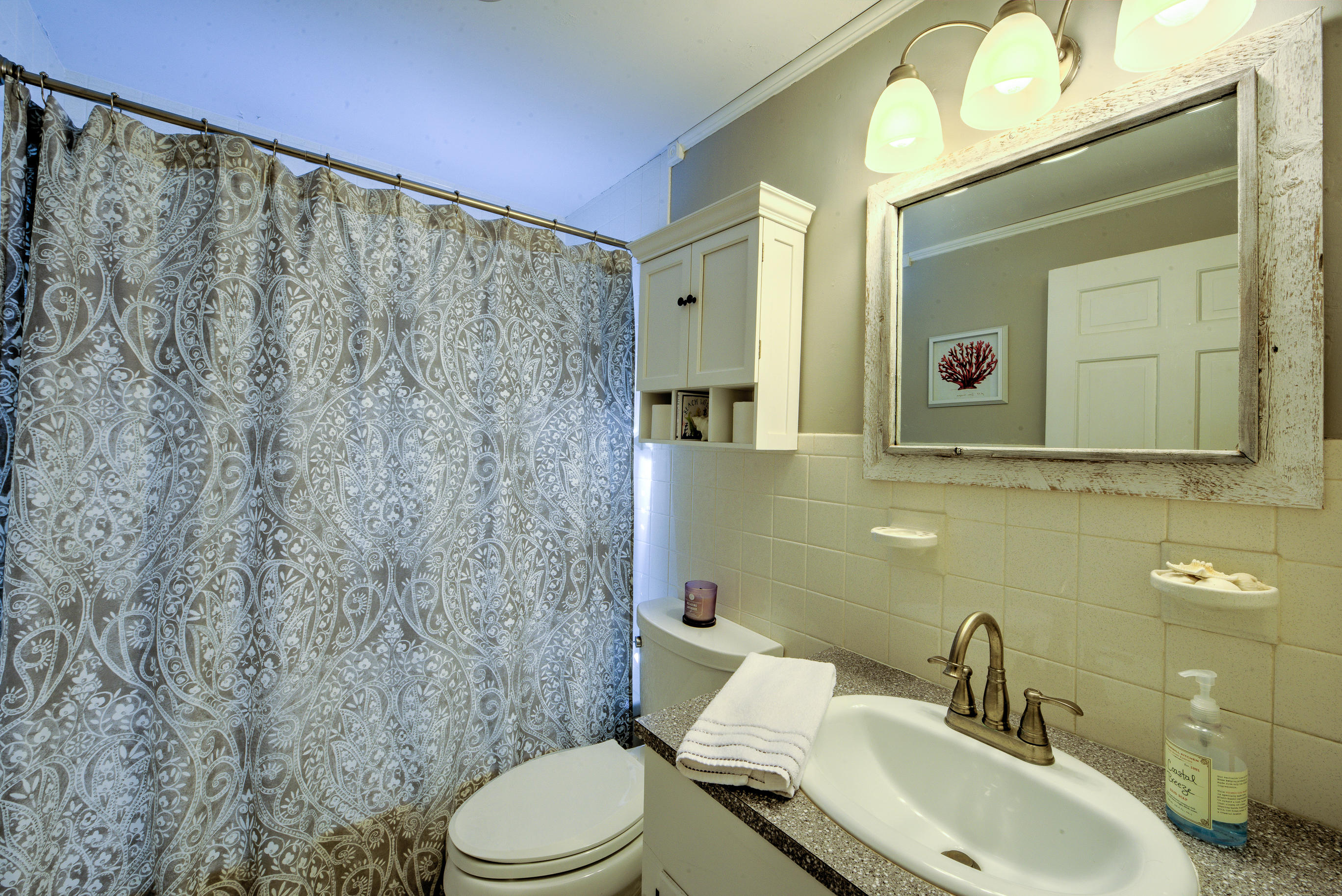 36 Deep Hole Road Harwich Port, MA 02646 - Photo 30 of 34 a bathroom with a toilet a sink and mirror
