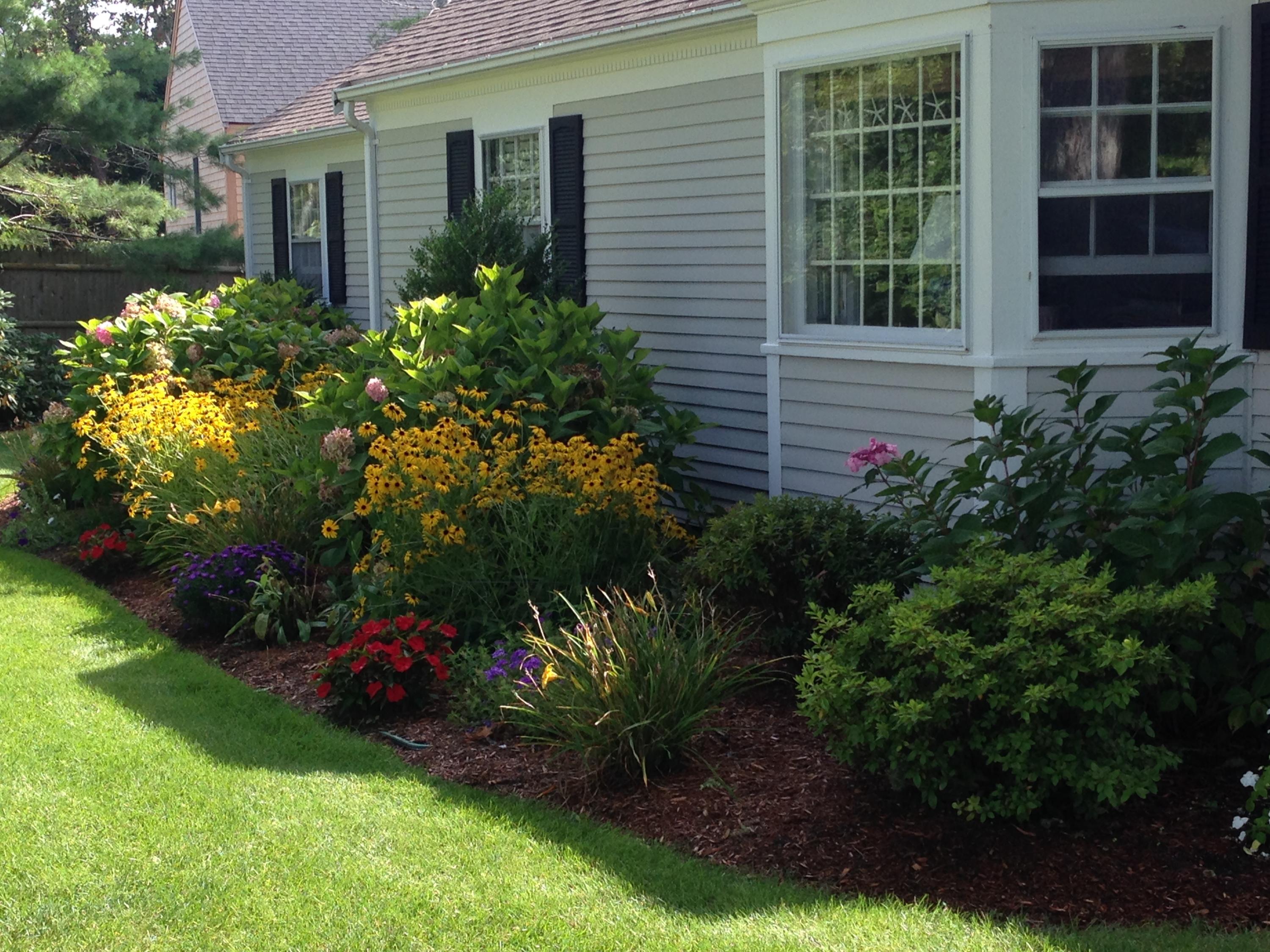 36 Deep Hole Road Harwich Port, MA 02646 - Photo 3 of 34 a front view of a house with a yard and potted plants