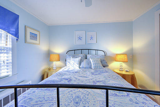 36 Deep Hole Road Harwich Port, MA 02646 - Photo 34 of 34 a bed sitting in a bedroom next to a window