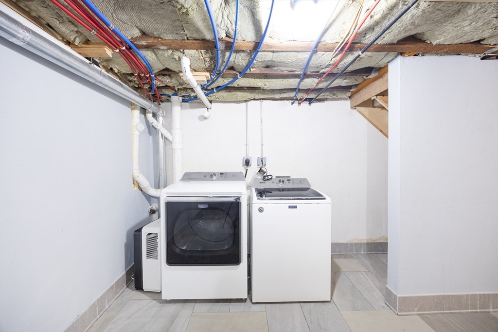 48 Spruce Street, Unit 1 Winchester, MA 01890 - Photo 28 of 29 a utility room with dryer and washer