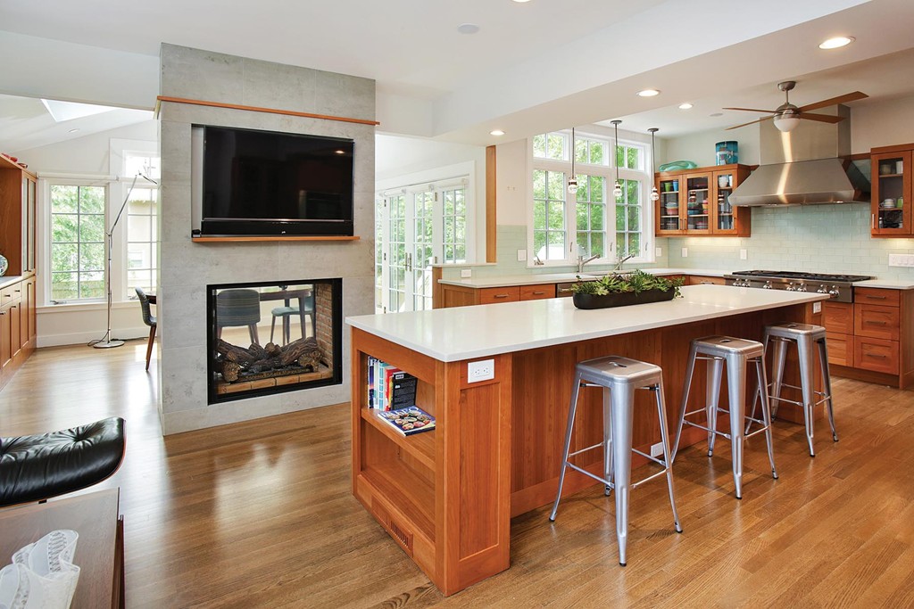 21 Salisbury Road Brookline, MA 02445 - Photo 6 of 12 a kitchen with stainless steel appliances granite countertop a stove and a wooden floor