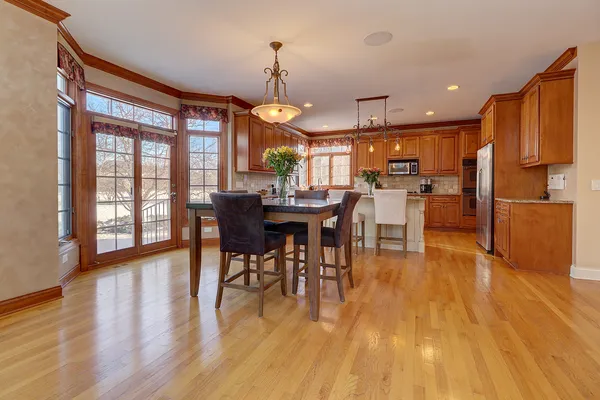 a view of a dining room with furniture window and wooden floor