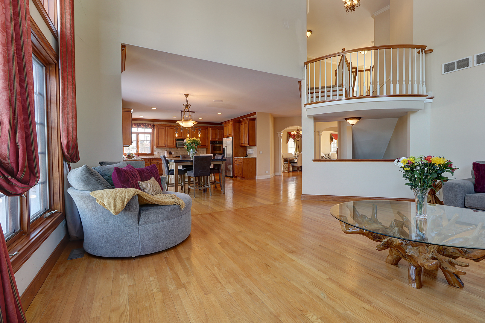 26025 Whispering Woods Circle Plainfield, IL 60585 - Photo 14 of 43 a living room with furniture and a chandelier