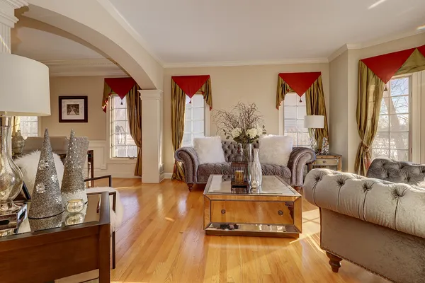 a view of a living room with furniture and a flat screen tv