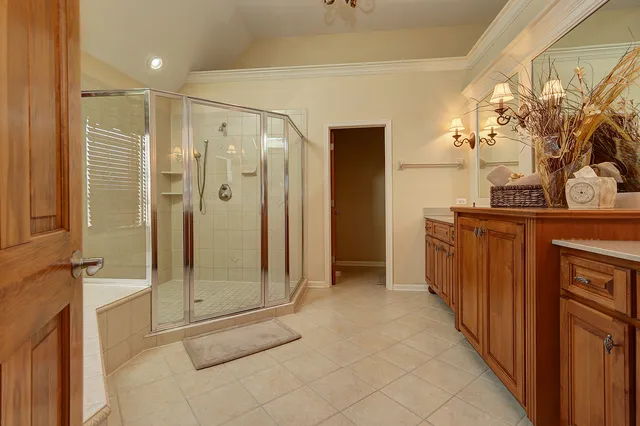 a bathroom with a glass shower door
