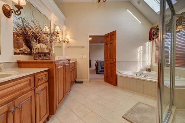 a view of a bathroom with a tub and sink