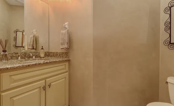 a utility room with granite countertop cabinets washer and dryer